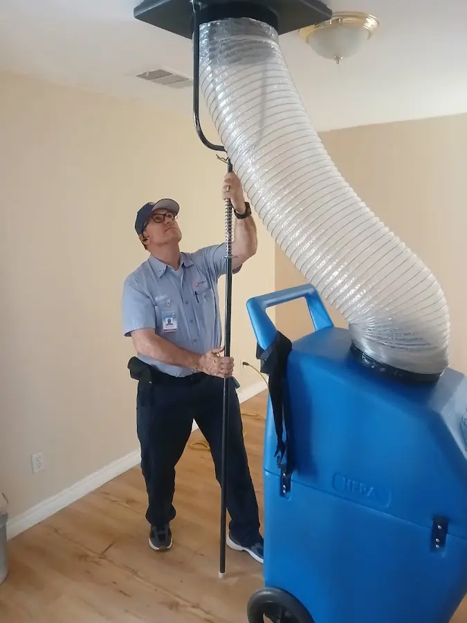Furnace Tune-Up technician using HEPA equipment in Saratoga